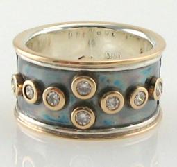 the finished ring with diamonds